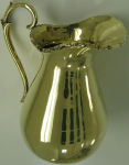 Photo of brass pitcher after metal restoration