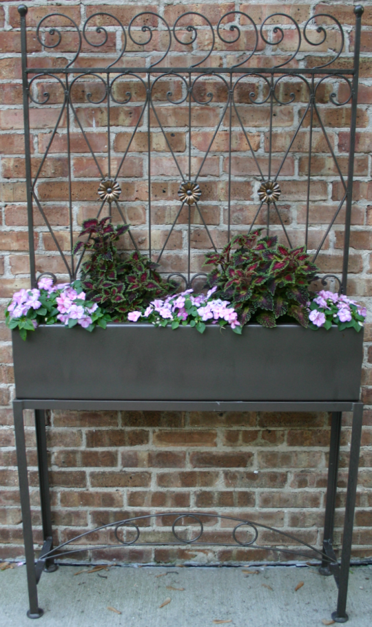 Photo of a flower box and stand.  We created the stand and finished both items.
