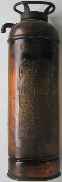 Photo of copper and brass fire extinguisher before metal restoration